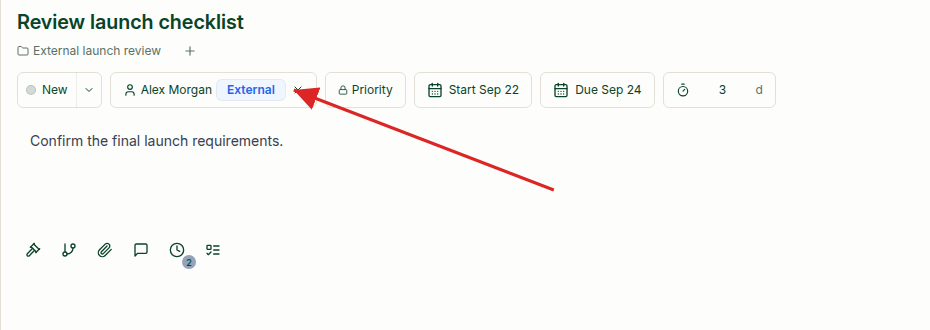 Task assigned to an external collaborator, with a red arrow highlighting the blue External badge beside the assignee