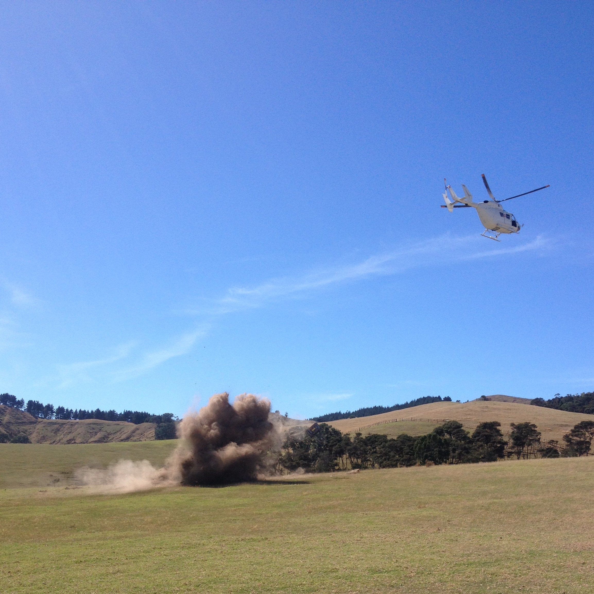 Helicopter flying over rural New Zealand